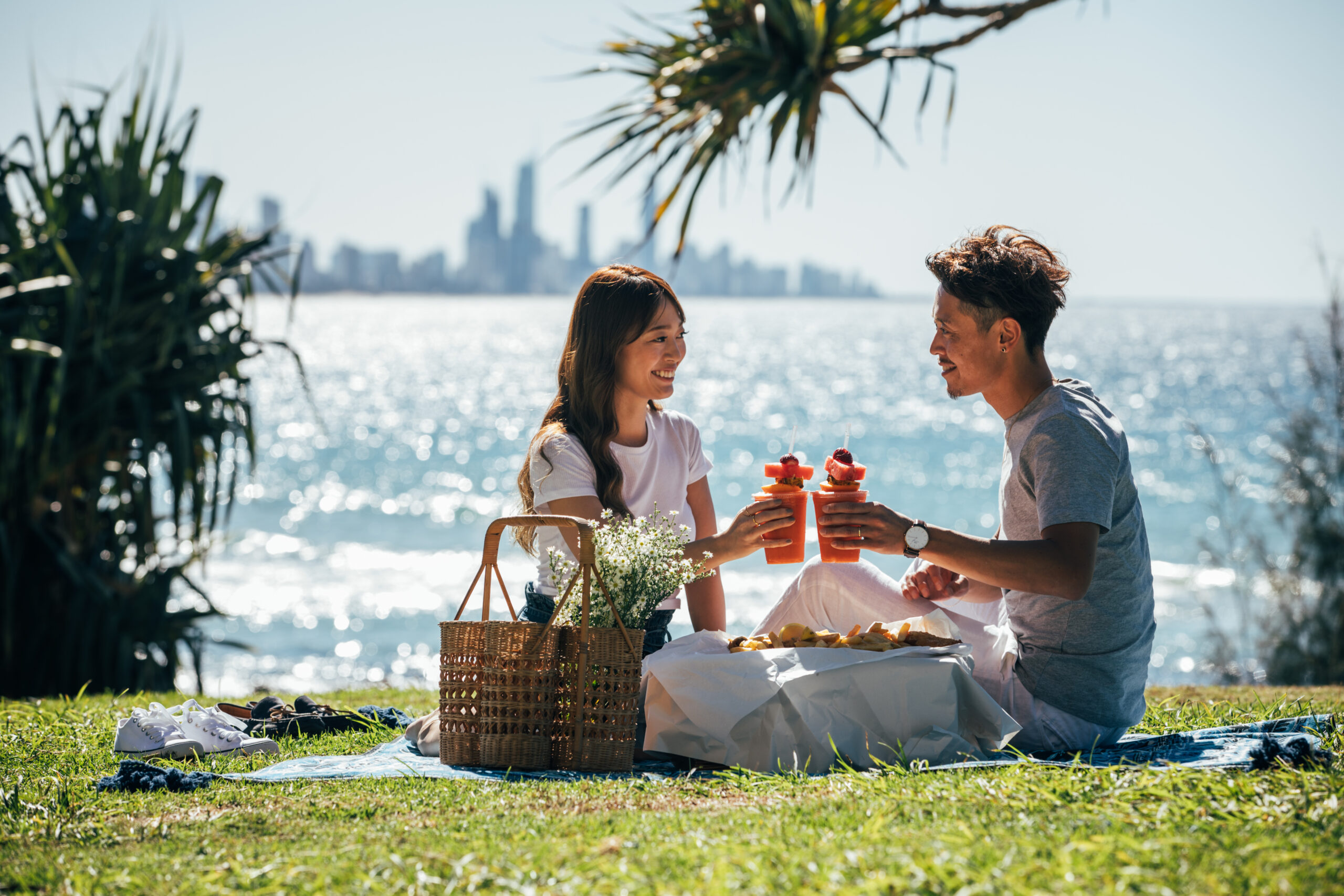 Couple enjoying picnic in front of Burleigh Beach